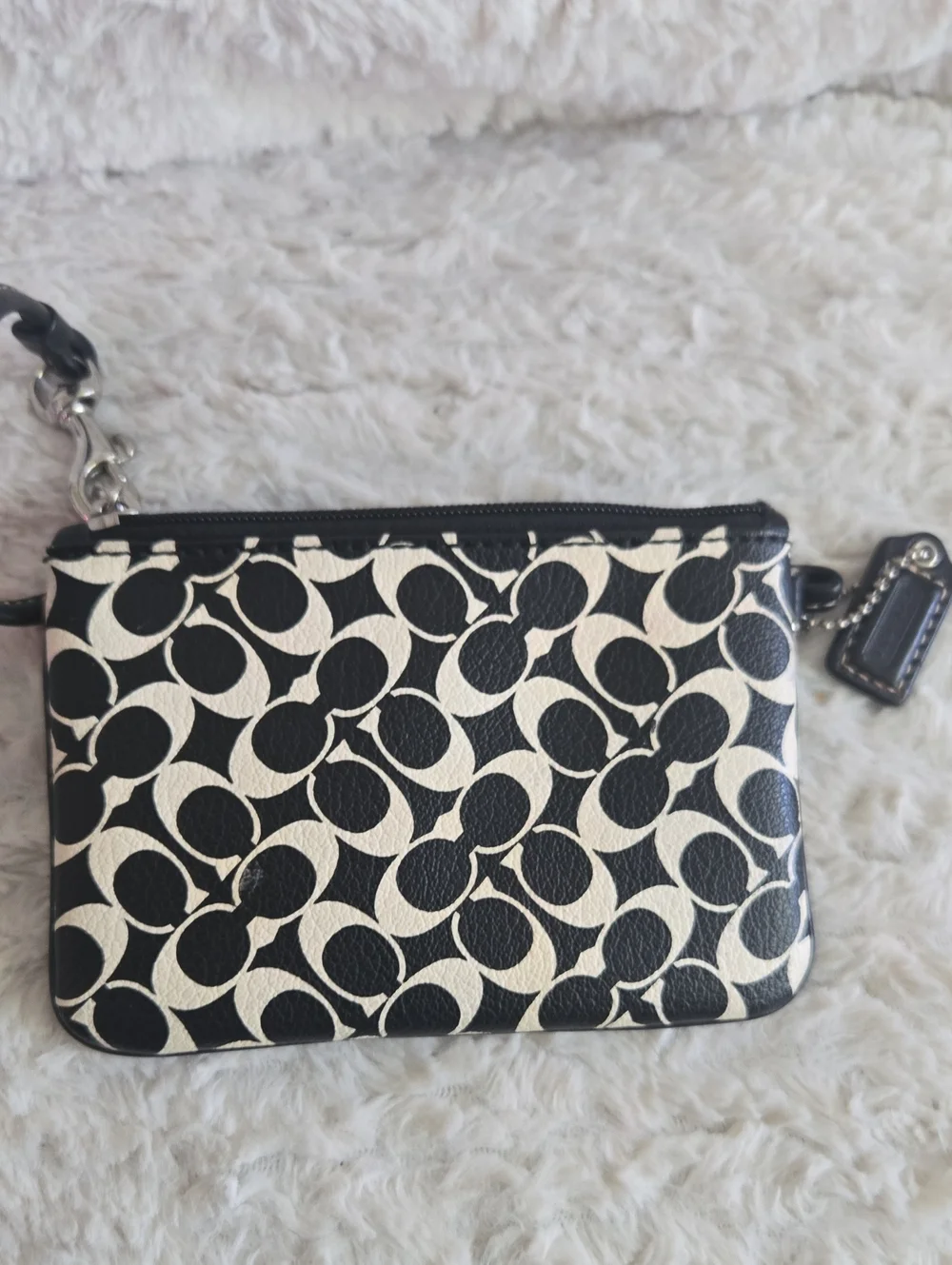 Coach wristlet featuring